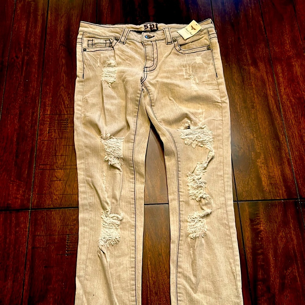 Ripped light colored jeans